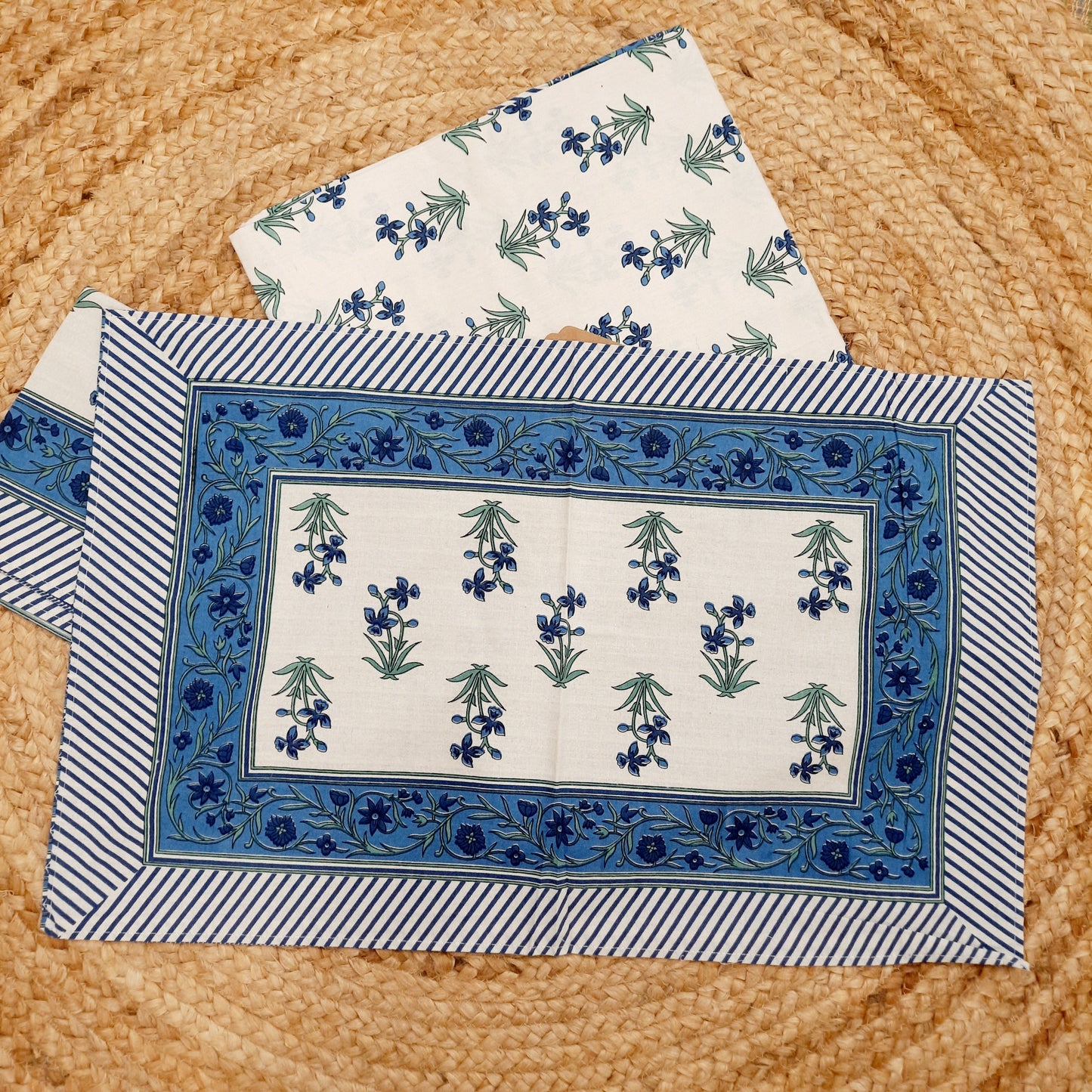 White and Blue Hand Block Print King Size Bedsheet With Blue Floral Motifs , Green Leaves And Blue Striped Border