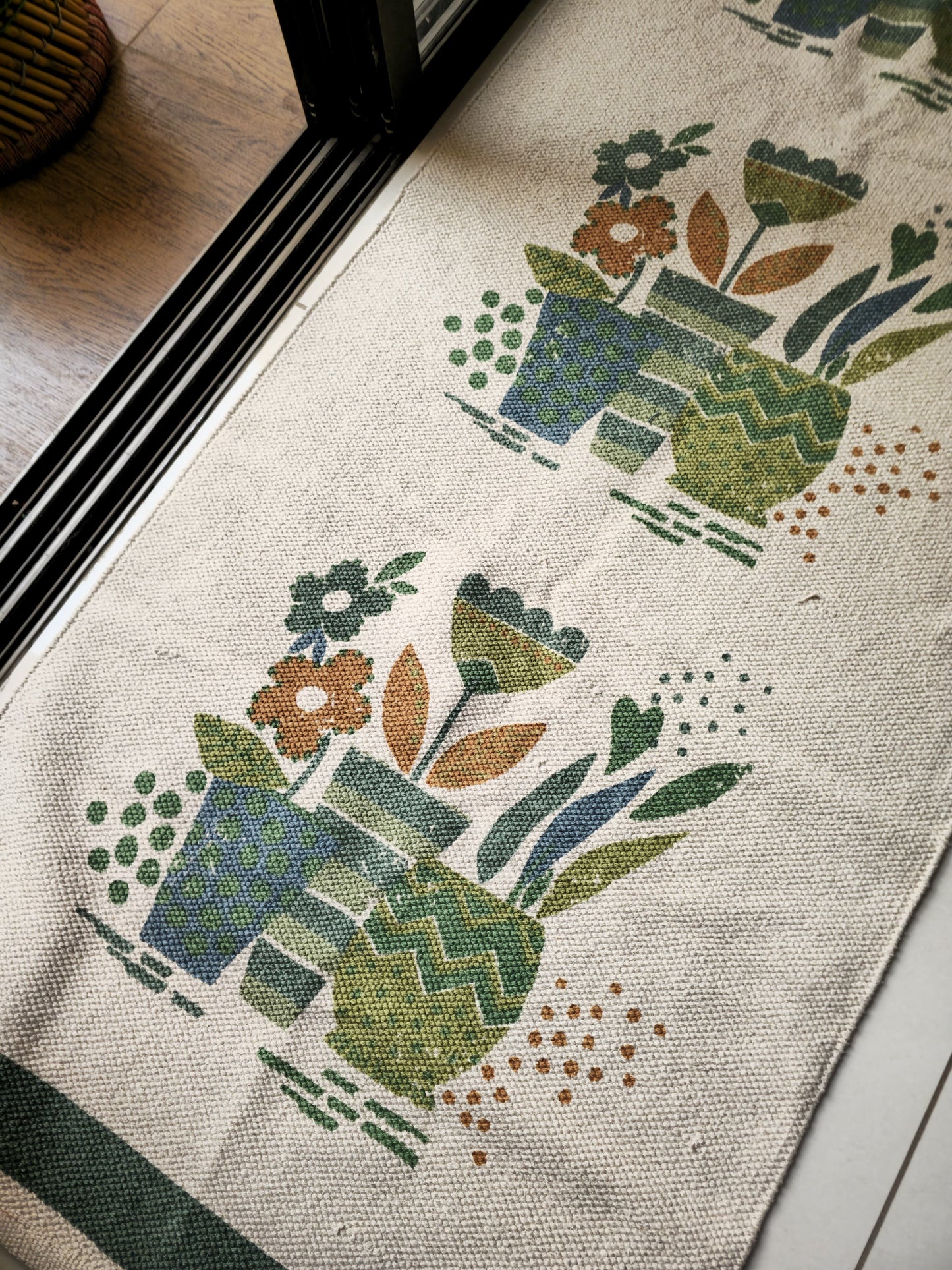 6x2.3 ft cream-colored pure cotton rug with subtle green flower pot design, perfect as a stylish bedside runner or balcony rug