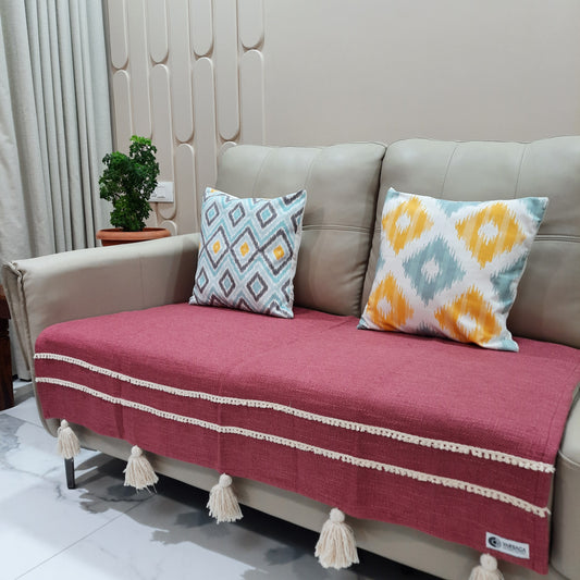 Boho chic sofa throw in magenta with handcrafted detailing