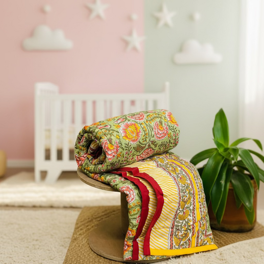 Folded Green and Yellow Floral Baby Quilt – Reversible Mulmul Cotton Blanket