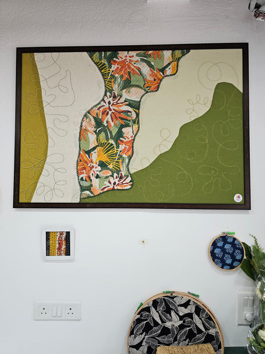 Hand-embroidered fabric wall art in wooden frame, featuring abstract floral design in layered greens, 3.5 x 2.5 ft