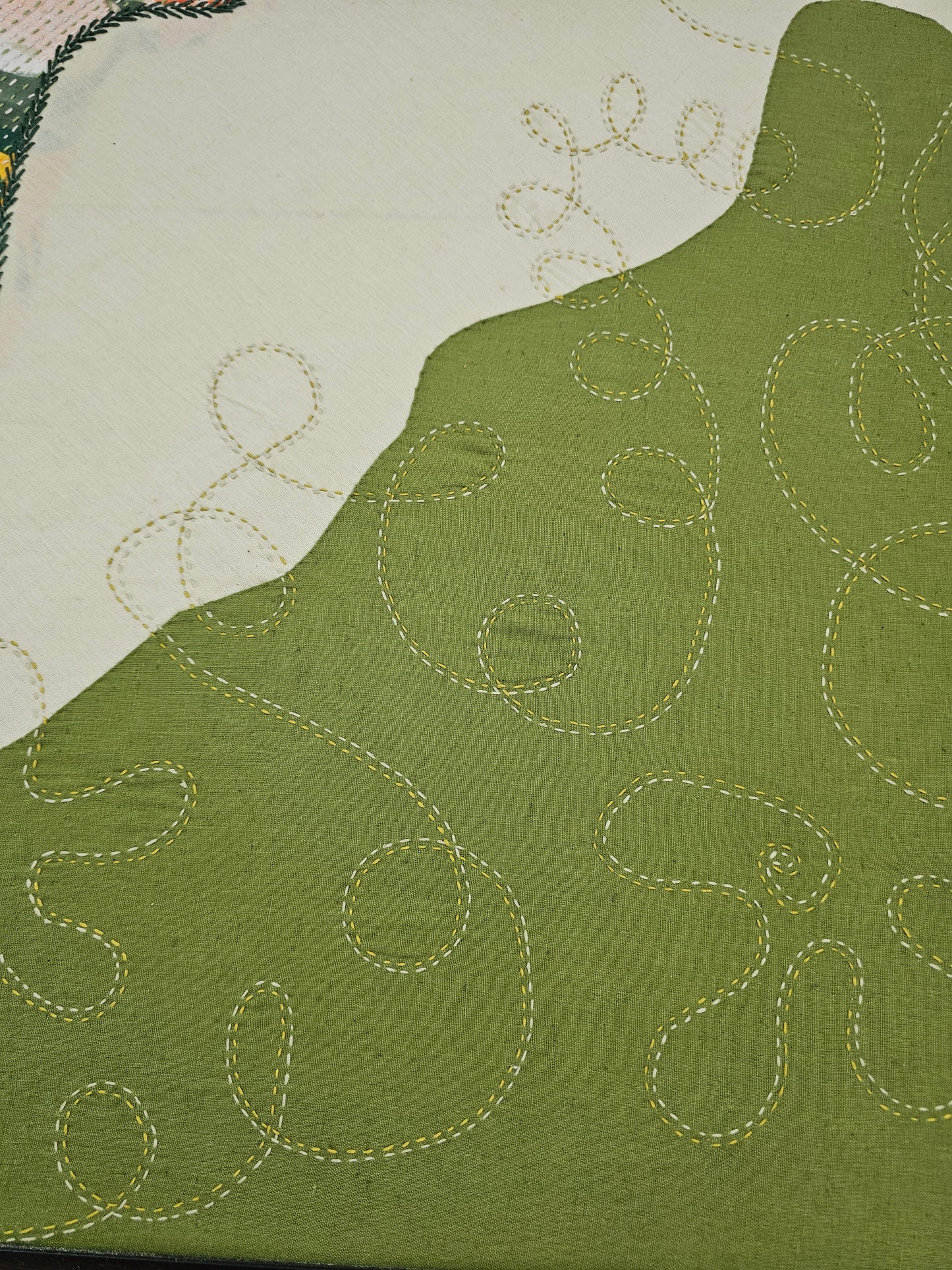 Handcrafted embroidered wall art displayed in modern living room, adding nature-inspired elegance to neutral interiors