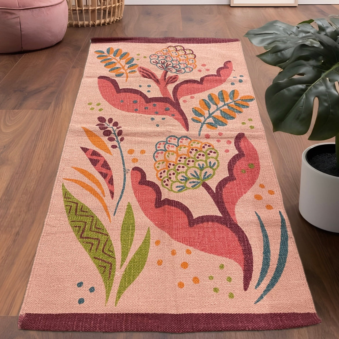 Handwoven peach cotton rug with abstract multicolor leaf design, 6x2.5 ft