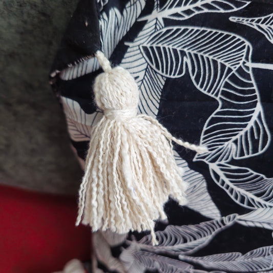 Modern sofa styling with black leaf print cushion