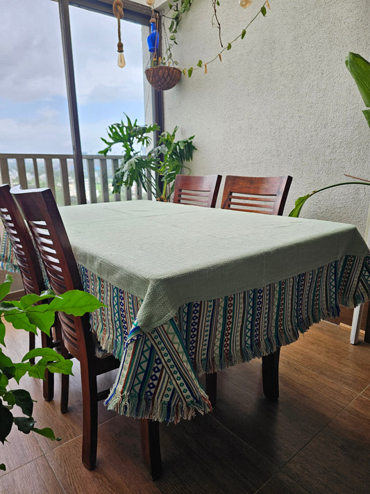 Dining room with a table, chairs, and decorative items.