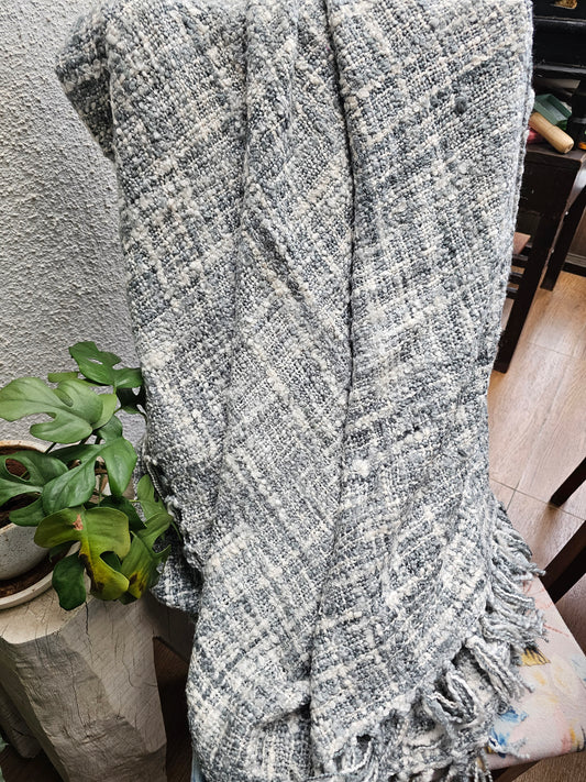 grey and white sofa throw