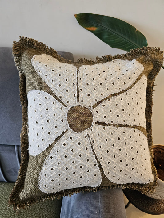 Decorative pillow with floral pattern on a chair