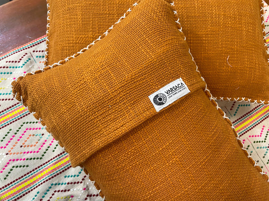 Rust Orange-colored fabric with a visible label on a colorful background