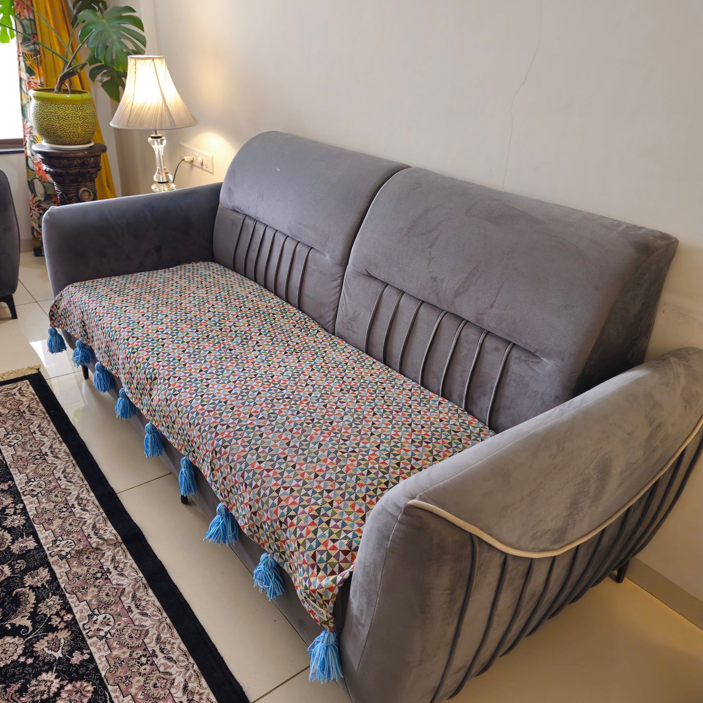 modern sky blue couch cover with tassels