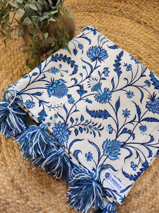 white blue floral motif throw