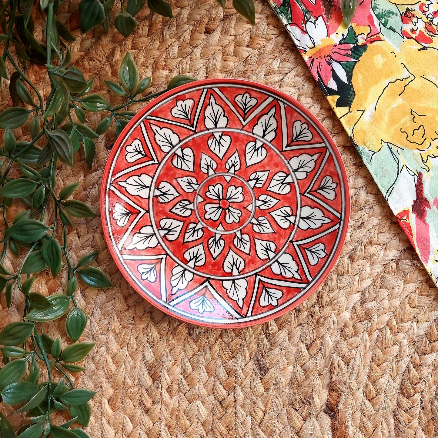 Hand-Painted Red Ceramic Wall Plate with Intricate Motifs