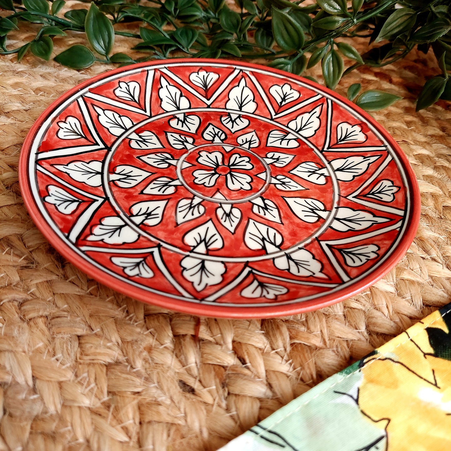 Hand-Painted Red Ceramic Wall Plate with Intricate Motifs