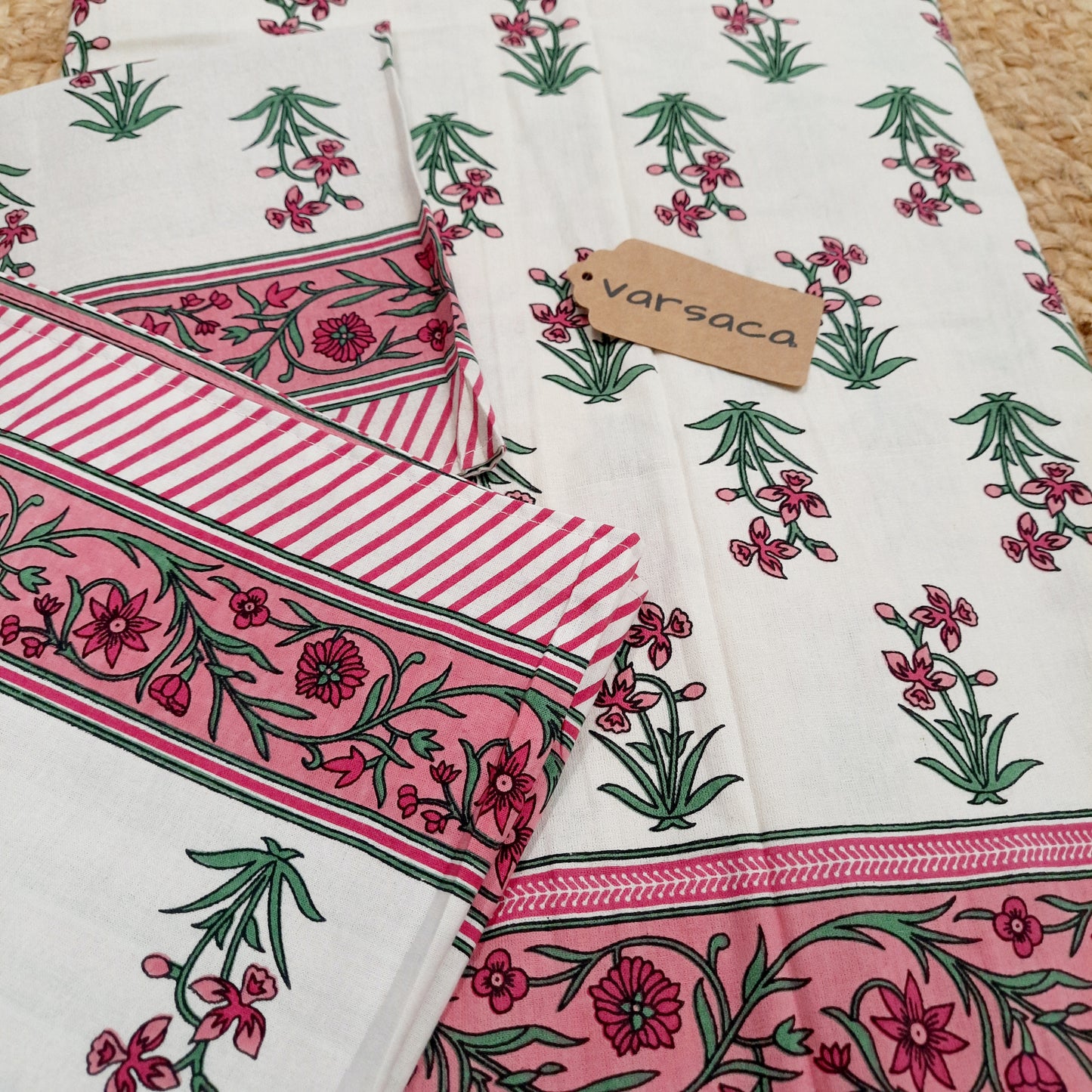 Pink and White Hand Block Print King Size Bedsheet With Pink Floral Motifs , Green Leaves And Pink Striped Border