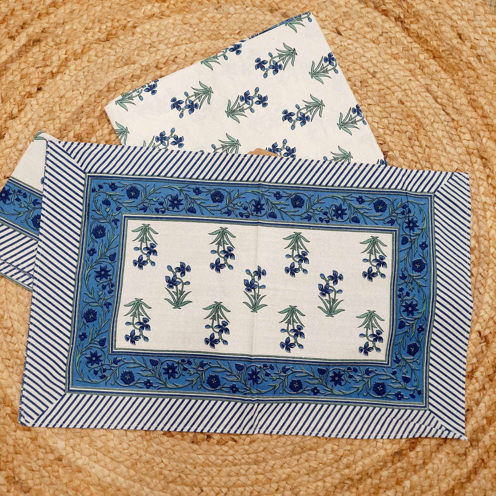 White and Blue Hand Block Print King Size Bedsheet With Blue Floral Motifs , Green Leaves And Blue Striped Border