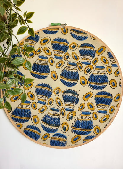 Decorative plate with blue and yellow pattern on a white background