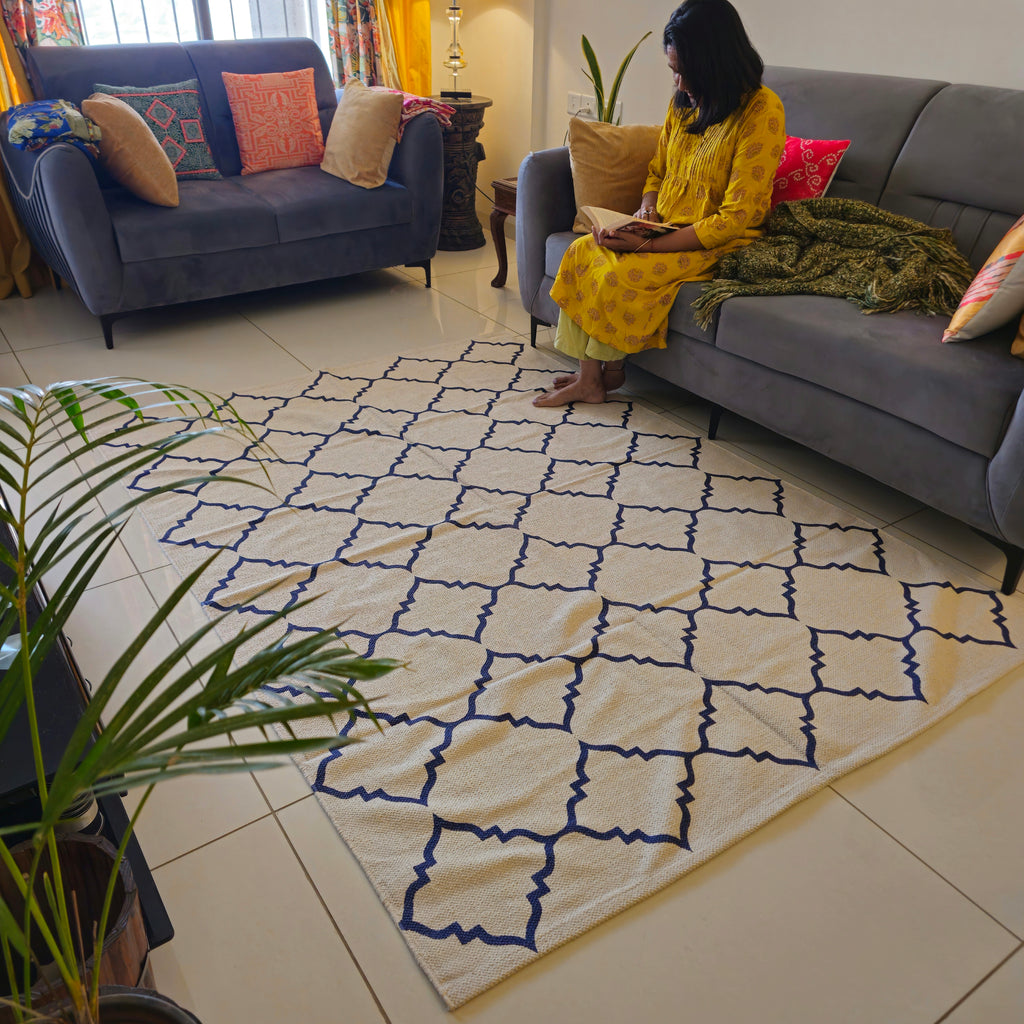 7x5 ft white and blue cotton dhurrie rug with Persian-inspired patterns and tassels