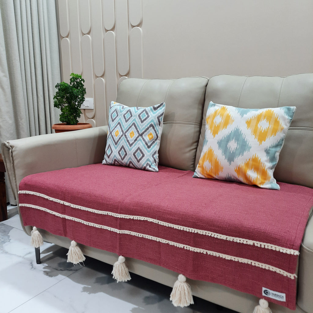Boho chic sofa throw in magenta with handcrafted detailing