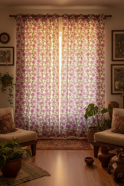Close-up of a floral patterned fabric with purple flowers and green leaves.
