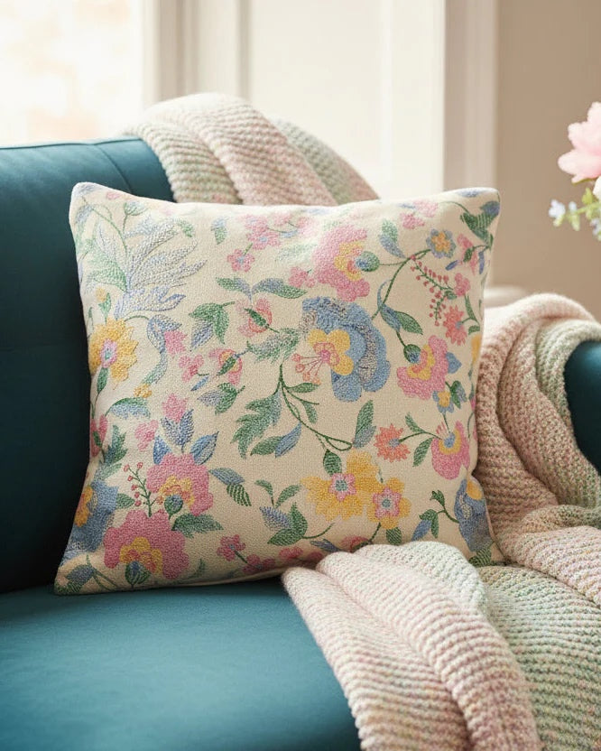 Close-up of the textured jacquard weave and envelope-style closure on the floral pastel cushion.