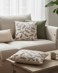 Beige sectional sofa with decorative pillows and a wooden coffee table in a living room setting.