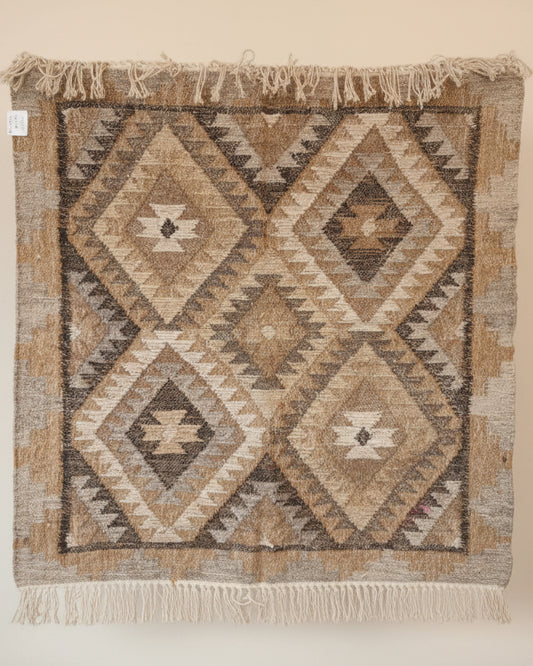 Textile with geometric pattern on a beige background