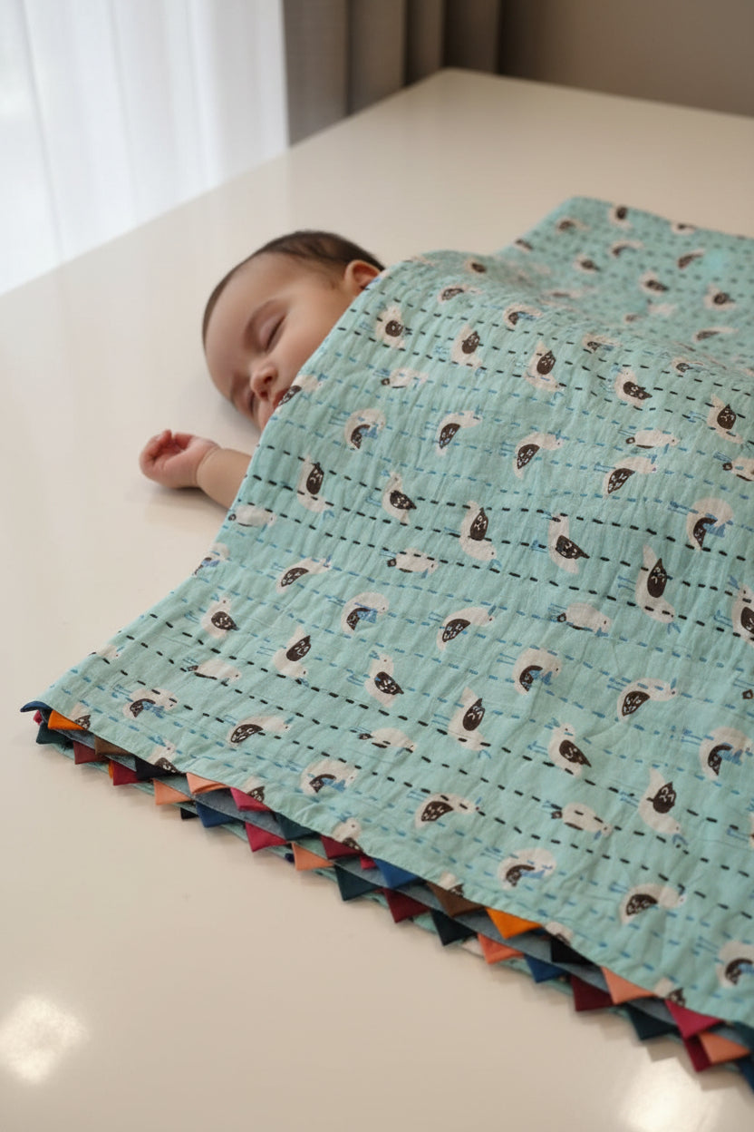 Fabric with bird pattern on a light blue background