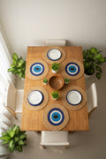 Round woven wall hanging with blue and white center