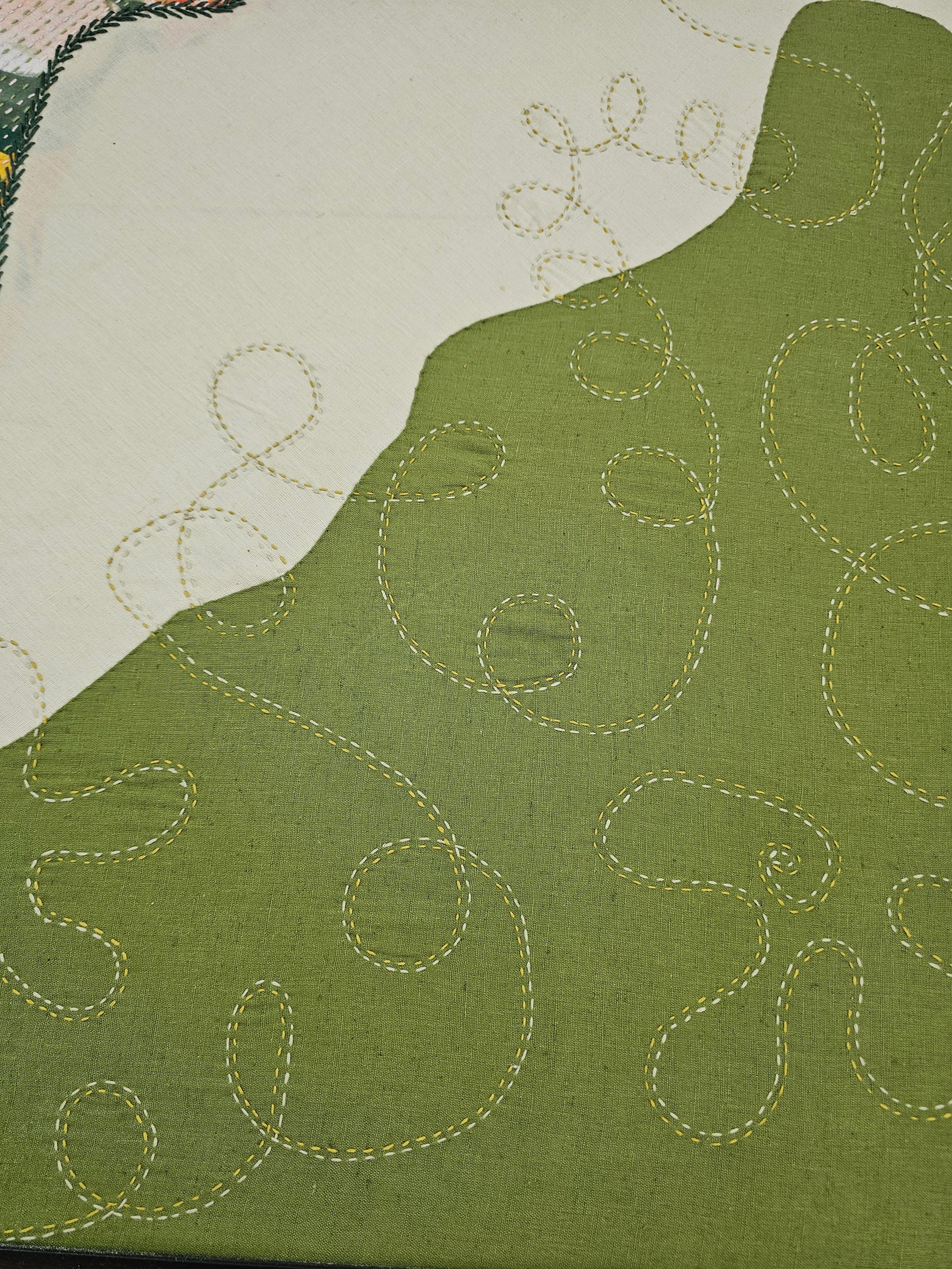 Handcrafted embroidered wall art displayed in modern living room, adding nature-inspired elegance to neutral interiors