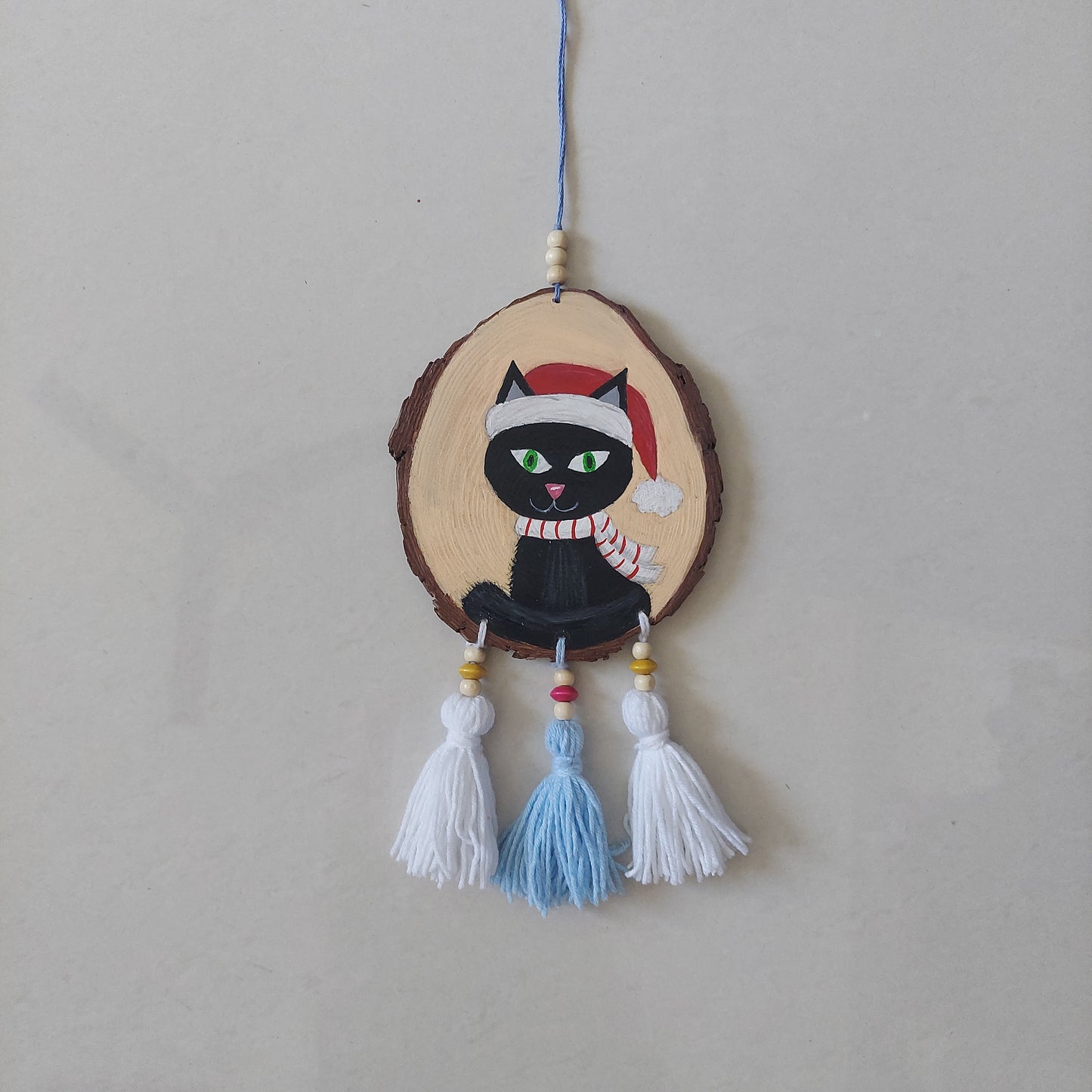 Handpainted Wooden Wall Hanging With Tassels