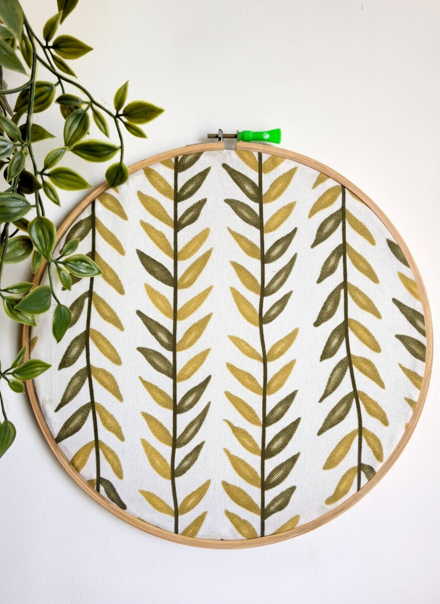 Leaf Vine Embroidery Hoop in Shades of Green on White Fabric