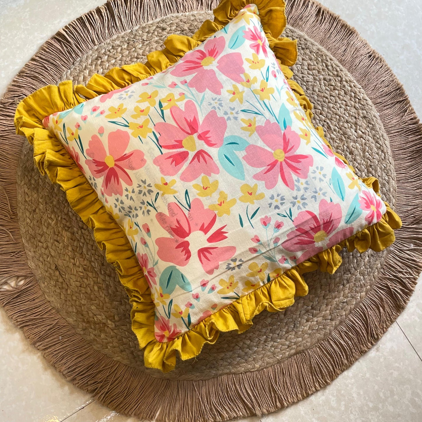 Multicolor floral cushion with bright yellow frill