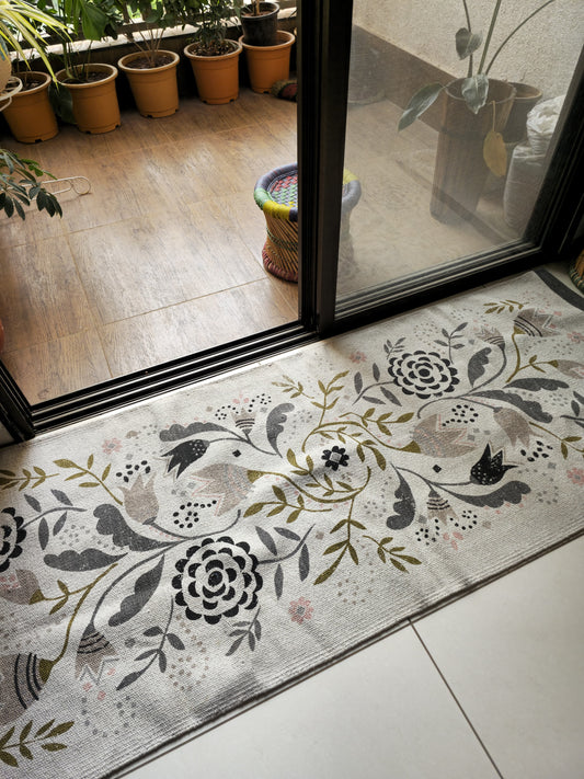 Neutral-toned pure cotton rug with abstract floral print, ideal for entryways and modern Indian interiors