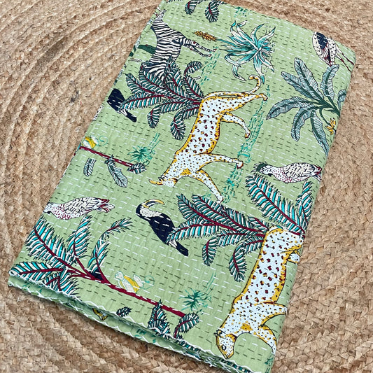 Fabric swatch with animal and nature pattern on a textured surface