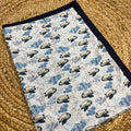 Sky_blue_cotton_baby_blanket_with_airplane_print_and_navy_border_60x45_inches