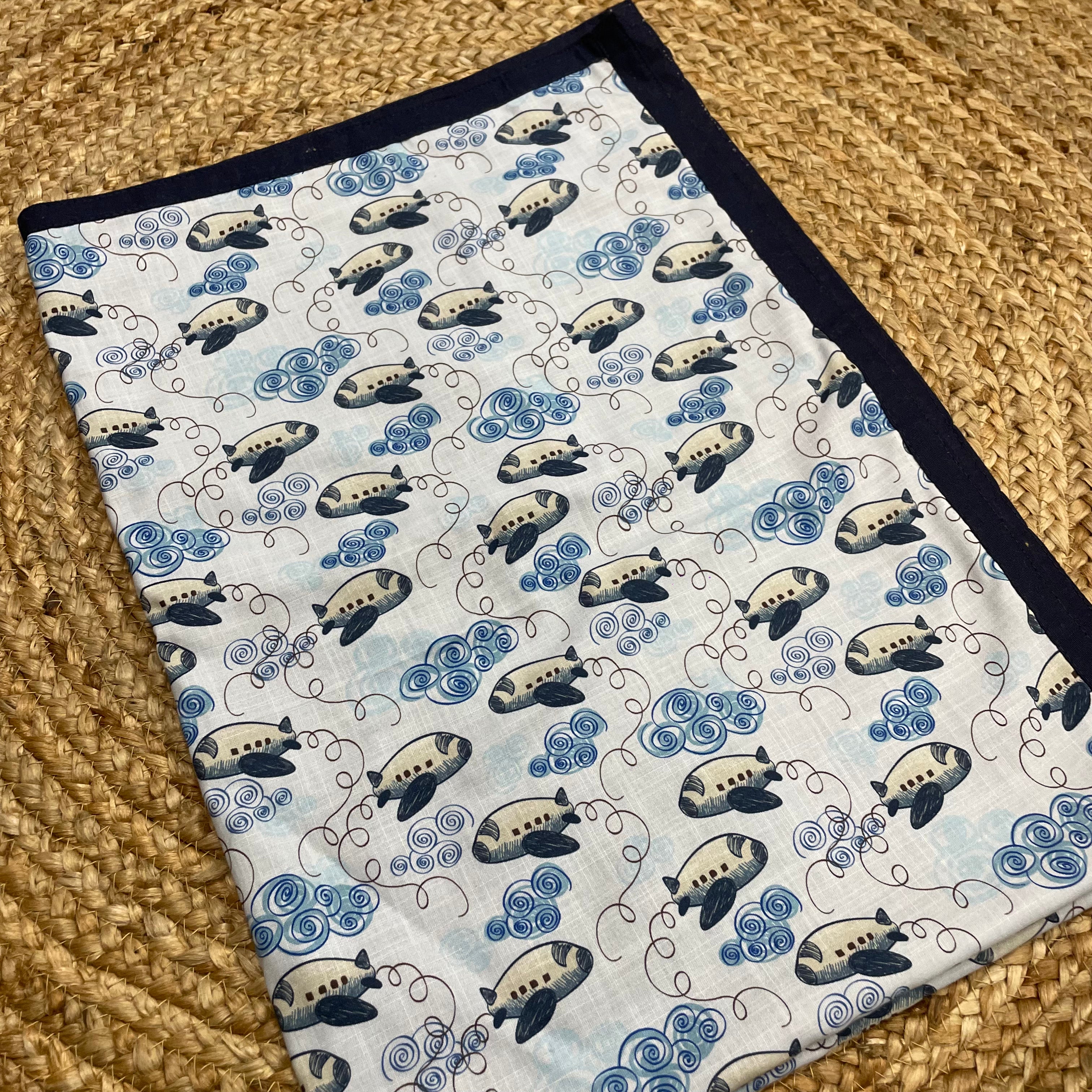 Sky_blue_cotton_baby_blanket_with_airplane_print_and_navy_border_60x45_inches