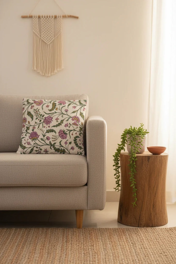 Styled living room featuring the green, pink, and beige floral cushion set with matching plants and decor.