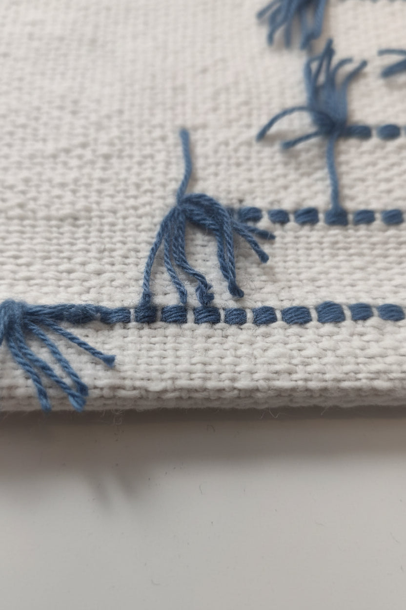 Textile with blue patterns on a white surface