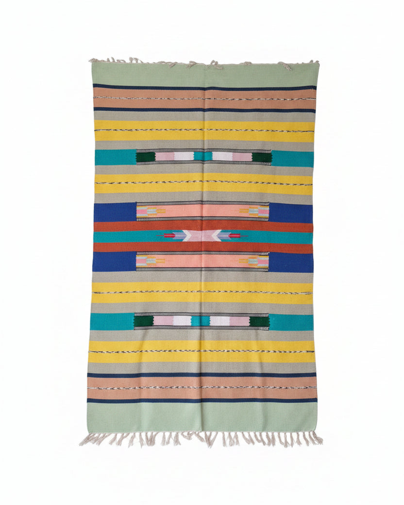 Vasaca 100% handloom pure cotton 4x6 area rug featuring a vibrant multi-color Aztec geometric pattern with fringed tassels.