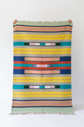 Vasaca 100% handloom pure cotton floor runner rug featuring a vibrant multi-color Aztec geometric pattern with fringed tassels.