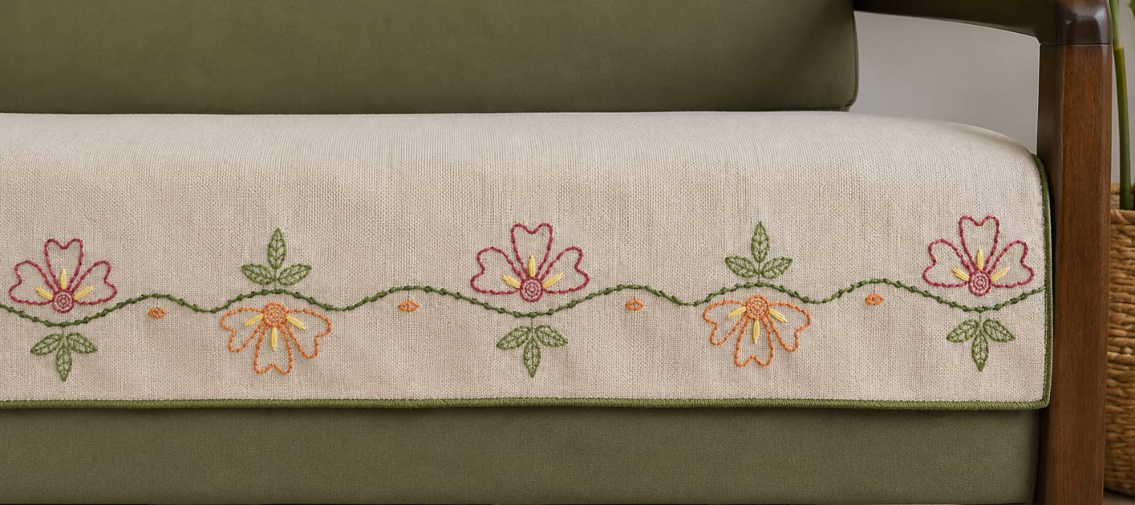 Vasaca oatmeal jute-cotton seat-only sofa runner with a hand-embroidered wildflower vine border in terracotta, pink, and green, tailored for a three-seater sofa.