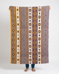 Vasaca rust brown and ochre yellow handwoven cotton jacquard runner rug with geometric tribal pattern, Aztec diamonds, and starburst panels.