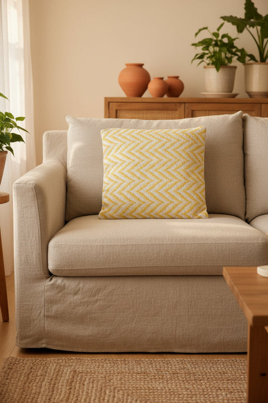 Yellow and white chevron patterned pillow