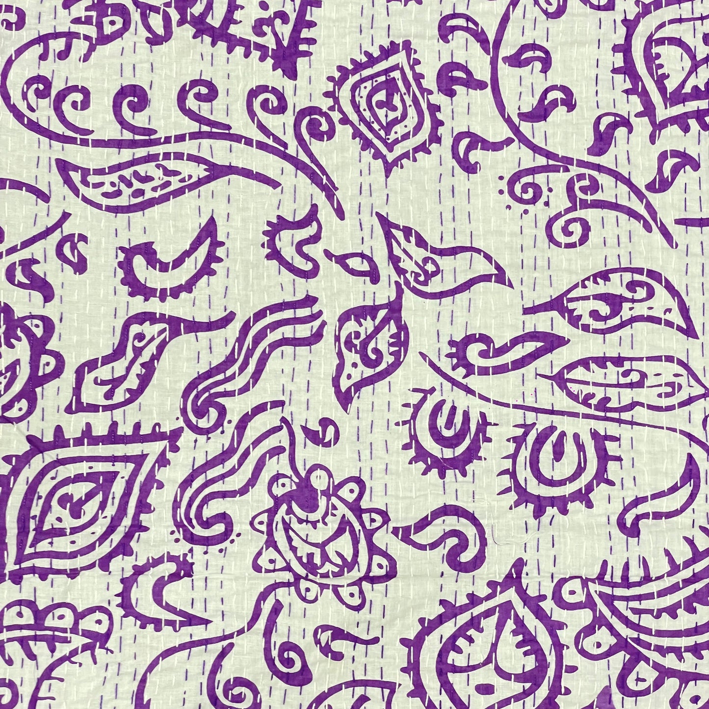 Purple paisley pattern on a textured beige background