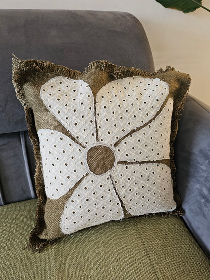 Decorative pillow with a floral pattern on a couch