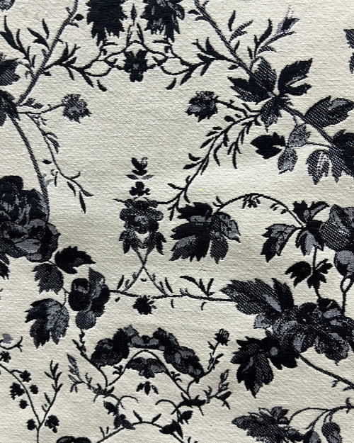 Black and white floral cotton jacquard table cover featuring a reversible monochrome woven pattern and decorative fringe tassels.
