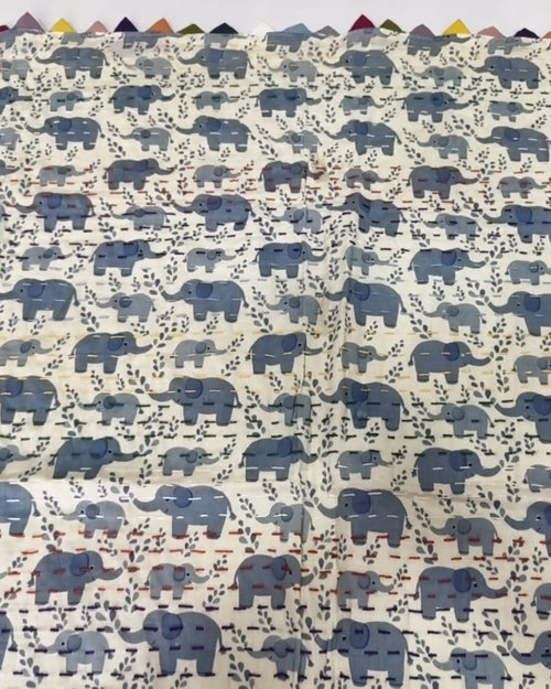 Blue elephant block-printed pure cotton Kantha baby quilt showing detailed hand running stitches and reversible cotton layers.