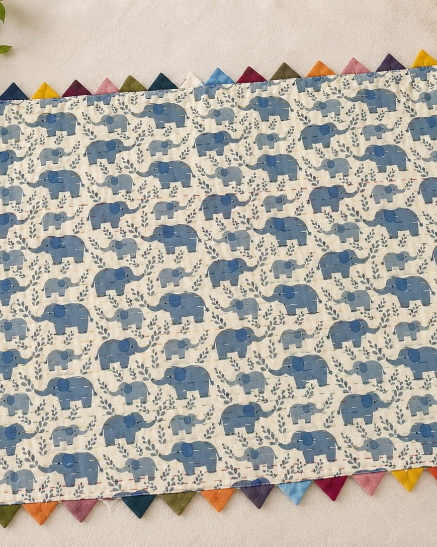 Blue elephant block-printed pure cotton Kantha baby quilt showing detailed hand running stitches and reversible cotton layers.