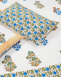 100x108 inch king size cotton bedsheet and matching striped pillow covers styled with a traditional blue floral butta and orange motif handblock print.
