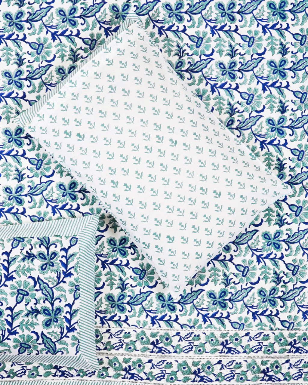 100x108 inch king size cotton bedsheet and matching striped pillow covers styled with a traditional blue and teal floral vine handblock print.