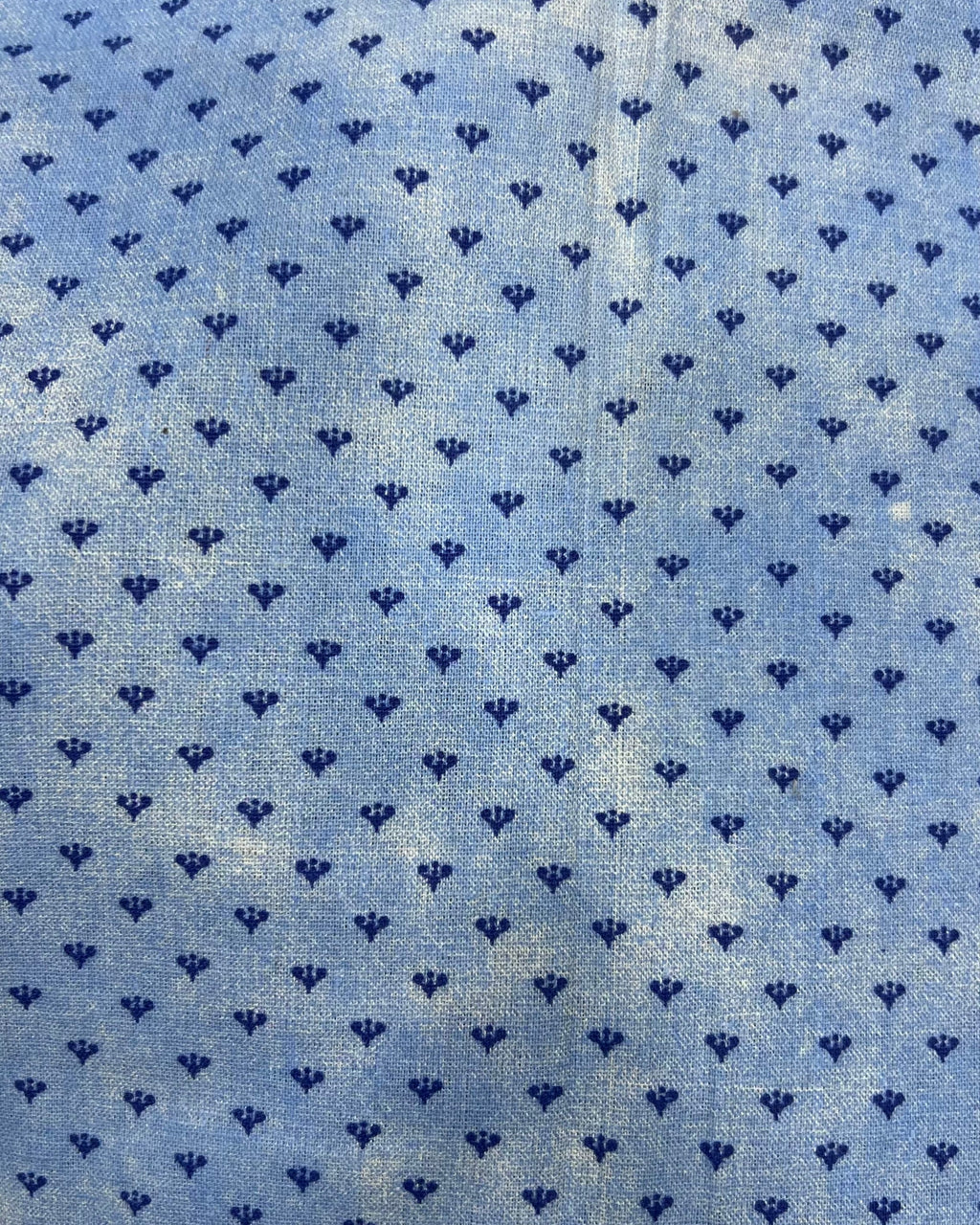 Blue and white small-print cotton table cover featuring a delicate micro-pattern and a contrasting checkered border trim.
